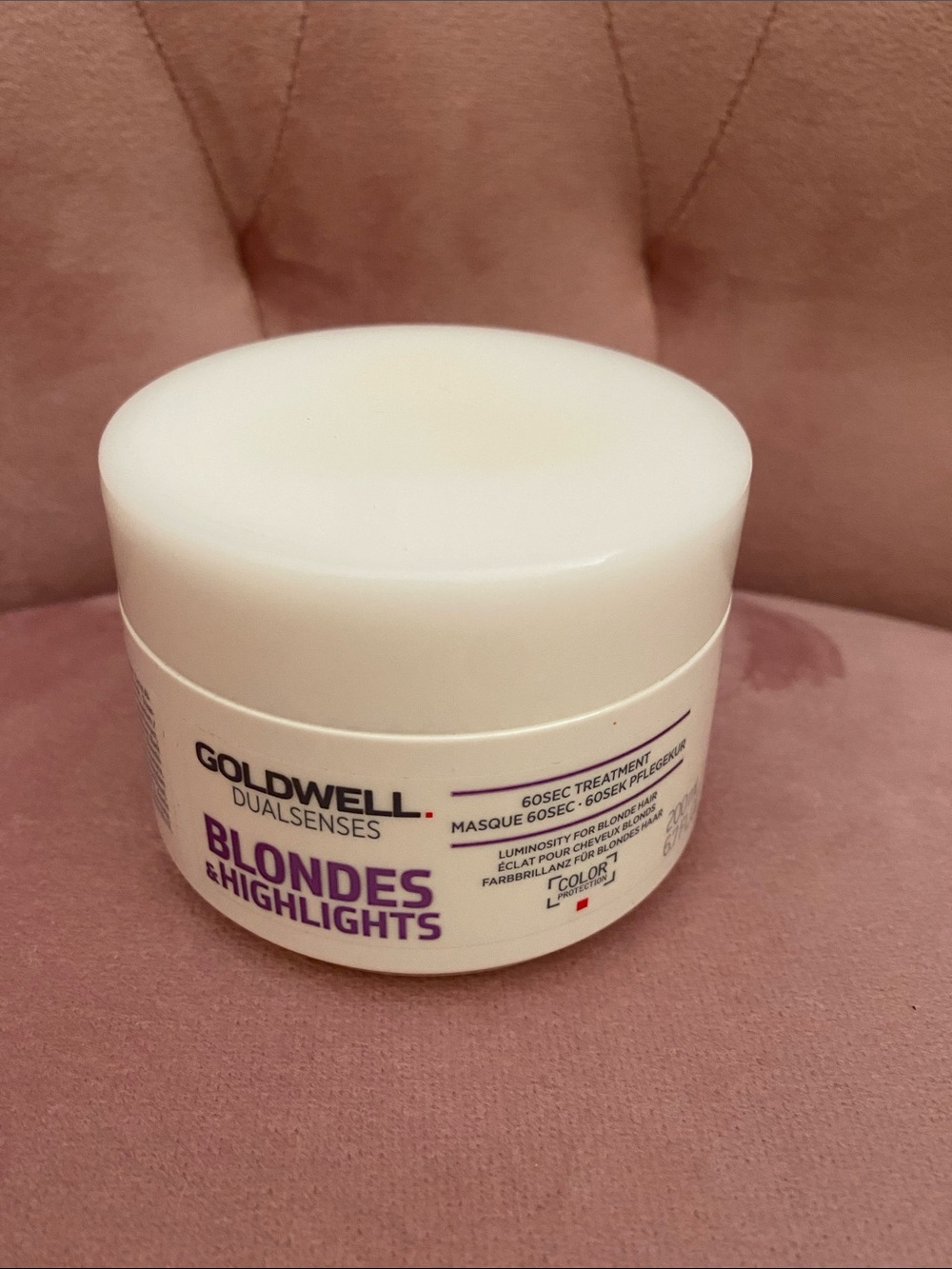dwell Blonde Hair Treatment Jar in White with Purple Text
